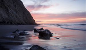 Preview wallpaper rocks, coast, sea, stones, water, sunset