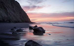 Preview wallpaper rocks, coast, sea, stones, water, sunset