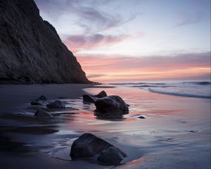 Preview wallpaper rocks, coast, sea, stones, water, sunset