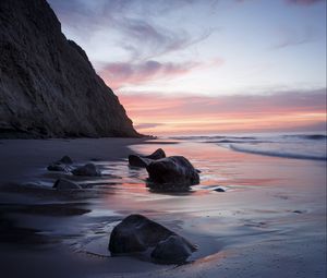 Preview wallpaper rocks, coast, sea, stones, water, sunset