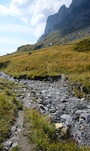 Preview wallpaper rocks, hill, grass, path, stones, nature
