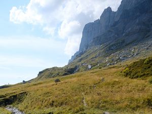 Preview wallpaper rocks, hill, grass, path, stones, nature
