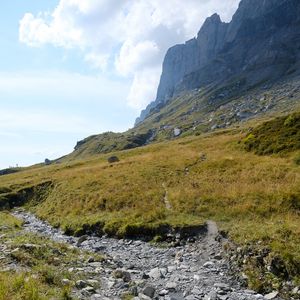 Preview wallpaper rocks, hill, grass, path, stones, nature