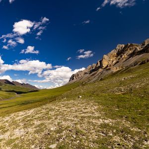 Preview wallpaper rocks, hills, field, clouds, landscape