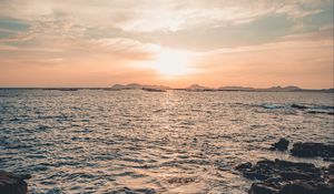 Preview wallpaper rocks, horizon, sea, sun