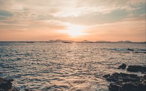 Preview wallpaper rocks, horizon, sea, sun