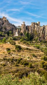 Preview wallpaper rocks, house, slope, bushes, grass, nature