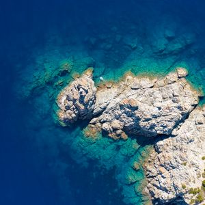Preview wallpaper rocks, island, sea, water, aerial view