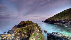 Preview wallpaper rocks, moss, cloudy, landscape, sea, grief