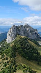 Preview wallpaper rocks, mountain, slope, trees, paraglider