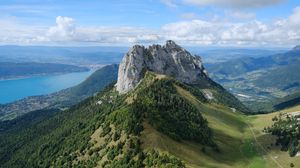 Preview wallpaper rocks, mountain, slope, trees, paraglider