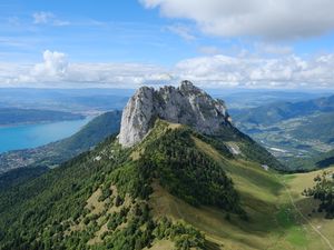 Preview wallpaper rocks, mountain, slope, trees, paraglider