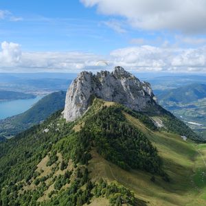 Preview wallpaper rocks, mountain, slope, trees, paraglider