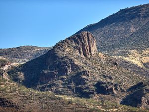 Preview wallpaper rocks, mountains, cactus, slope, sky