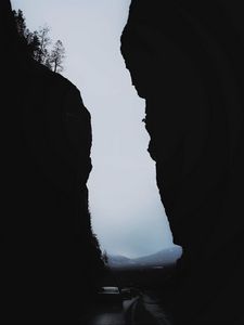 Preview wallpaper rocks, mountains, darkness, cars, night, fog