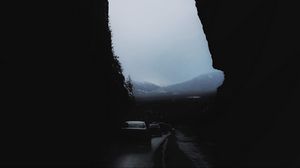 Preview wallpaper rocks, mountains, darkness, cars, night, fog