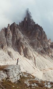 Preview wallpaper rocks, mountains, human, loneliness, peak