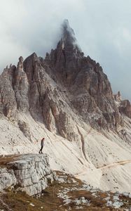 Preview wallpaper rocks, mountains, human, loneliness, peak