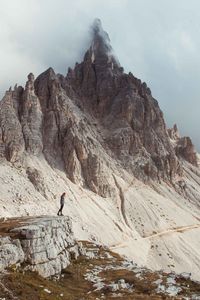 Preview wallpaper rocks, mountains, human, loneliness, peak