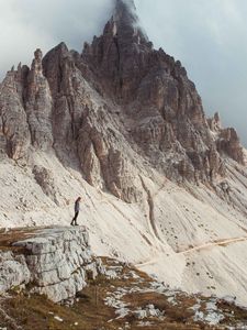 Preview wallpaper rocks, mountains, human, loneliness, peak