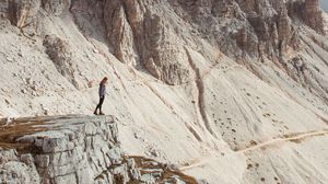 Preview wallpaper rocks, mountains, human, loneliness, peak