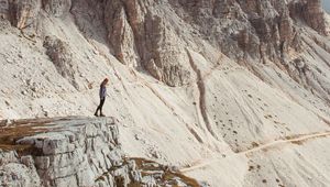 Preview wallpaper rocks, mountains, human, loneliness, peak