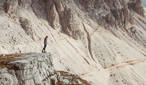 Preview wallpaper rocks, mountains, human, loneliness, peak