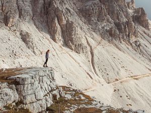 Preview wallpaper rocks, mountains, human, loneliness, peak