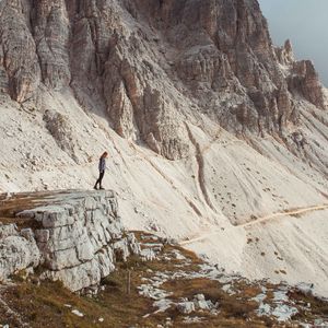 Preview wallpaper rocks, mountains, human, loneliness, peak