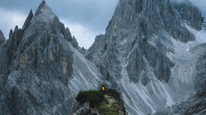 Preview wallpaper rocks, mountains, man, grass, sky