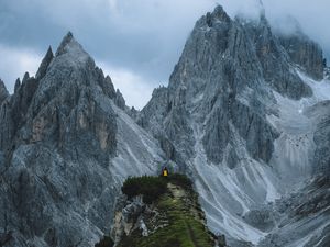 Preview wallpaper rocks, mountains, man, grass, sky