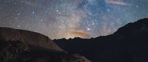 Preview wallpaper rocks, mountains, night, stars, starry sky, nebula