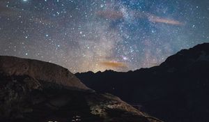 Preview wallpaper rocks, mountains, night, stars, starry sky, nebula