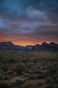 Preview wallpaper rocks, mountains, peaks, bushes, sunset, sky