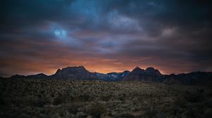 Preview wallpaper rocks, mountains, peaks, bushes, sunset, sky