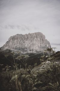 Preview wallpaper rocks, mountains, peaks, road, grass, sky