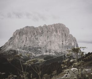 Preview wallpaper rocks, mountains, peaks, road, grass, sky