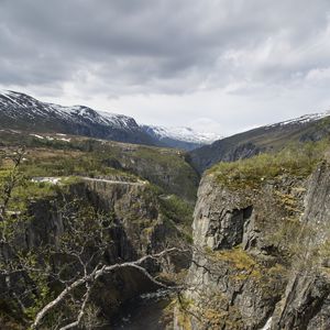 Preview wallpaper rocks, mountains, river, cliff, branches