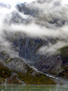 Preview wallpaper rocks, mountains, river, fog, grass