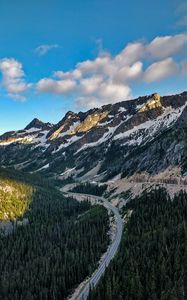 Preview wallpaper rocks, mountains, road, forest, slope