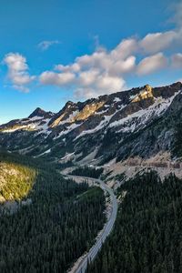 Preview wallpaper rocks, mountains, road, forest, slope