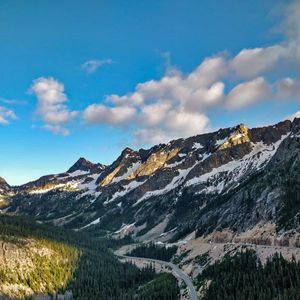 Preview wallpaper rocks, mountains, road, forest, slope
