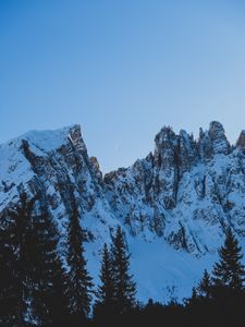 Preview wallpaper rocks, mountains, snow, snowy, spruce, moon