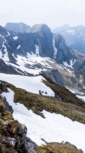 Preview wallpaper rocks, mountains, snow, snowy, stones, slope