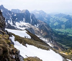 Preview wallpaper rocks, mountains, snow, snowy, stones, slope