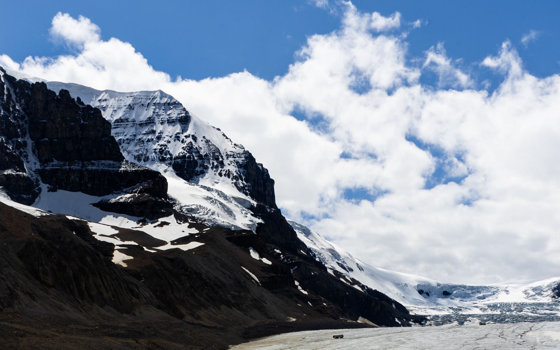 Download wallpaper 1920x1200 rocks, mountains, snow, snowy, stones, sky