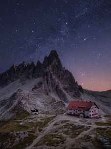 Preview wallpaper rocks, mountains, starry sky, house, night