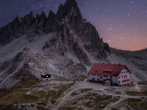 Preview wallpaper rocks, mountains, starry sky, house, night