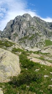Preview wallpaper rocks, mountains, stones, grass, sky, landscape