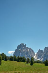 Preview wallpaper rocks, mountains, trees, grass, sky
